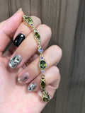gold green stone bracelet