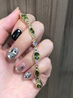 gold green stone bracelet