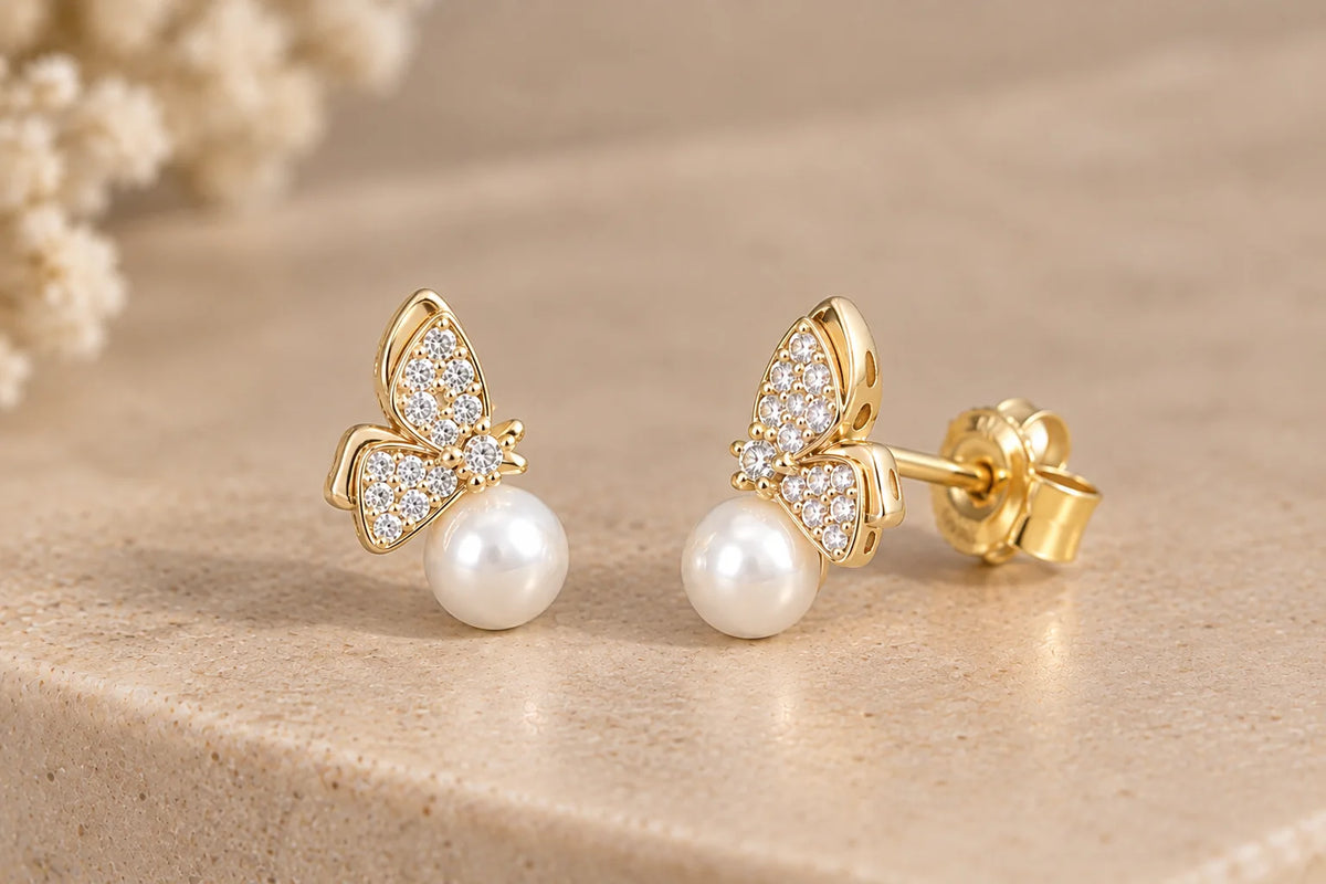 Butterfly earrings with white pearl accents