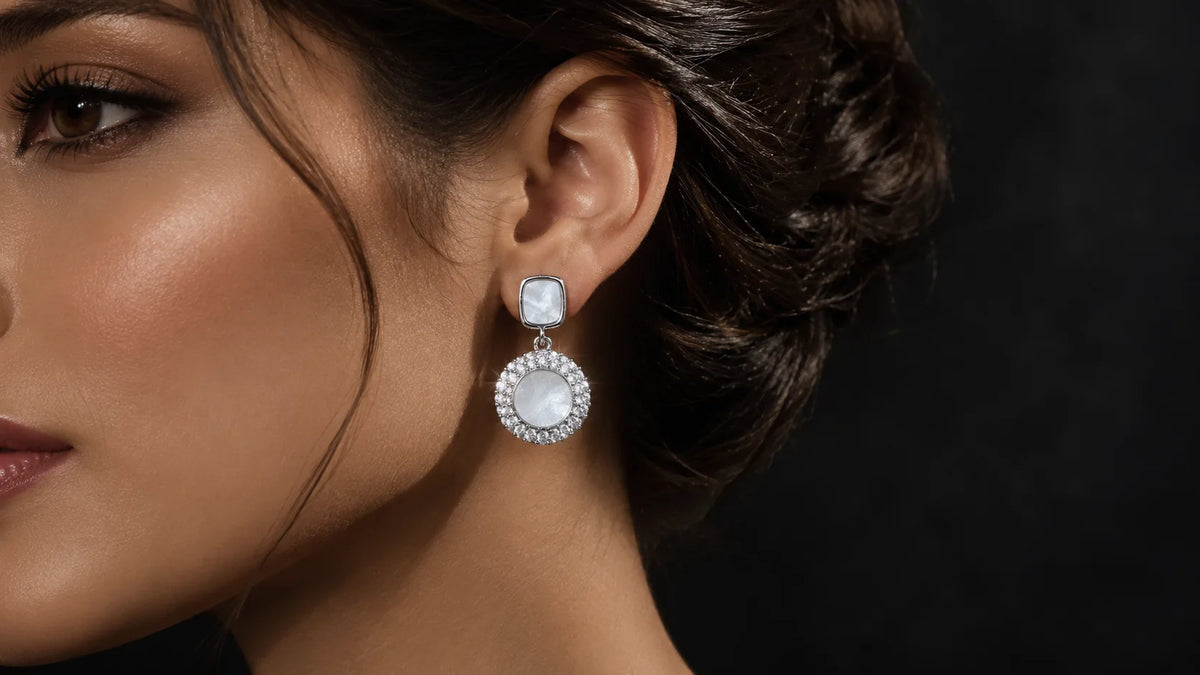 Silver pearl drop earrings with crystal borders