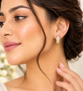 Golden hoops with rectangular clear stones