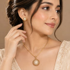 Golden sphere pendant necklace and earrings