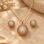 Round crystal pendant with matching studs