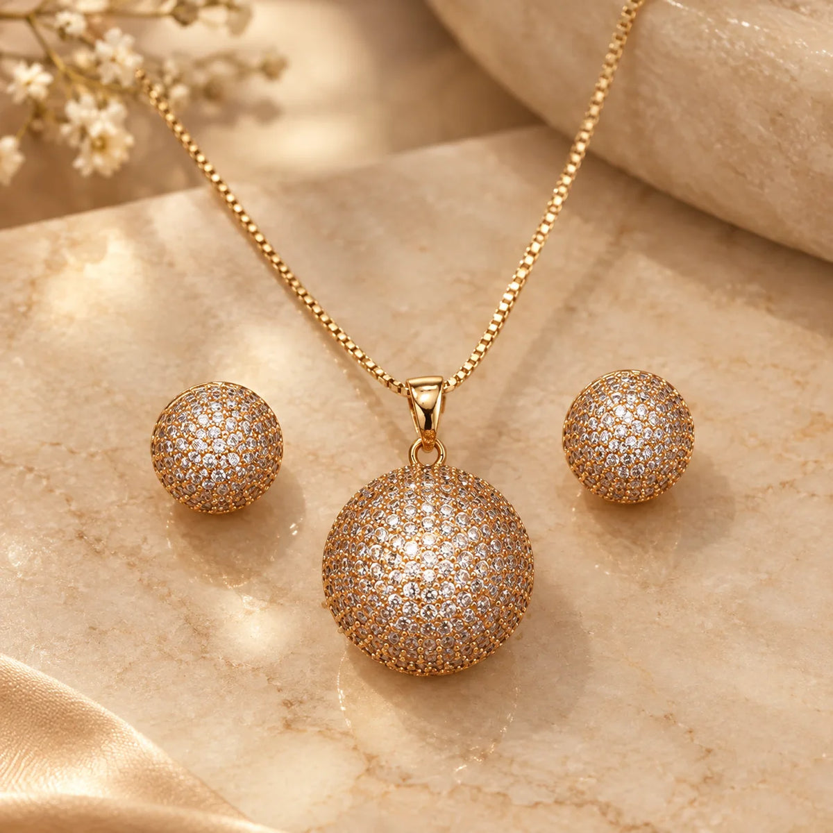 Round crystal pendant with matching studs