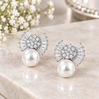 Silver bow earrings with large pearl drops