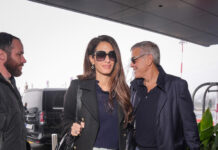 Amal Clooney ends her jeans hiatus with the hybrid denim trend it girls adore Amal Clooney's trip to the 2026 Winter Olympics appeared to fly by as quickly as Team USA figure skater Alysa Liu's short program. By February 8, the human rights lawyer had returned to Milan Airport. She wasn't dressed in Olympic gear either. Instead, a 2026 spin on the straight-leg jeans trend won the airport styling gold medal. Less than 48 hours after arriving in Italy, paparazzi caught Clooney in another travel-proof outfit. She ditched Friday's identical Versace outfit—down to the leopard-print boots—for comfortable basics, starting with a navy blue rollneck sweater and black peacoat. The surprises continued with her first pair of pants in eleven months: an emerging style of straight-leg jeans. She put on a pair of not-quite-flared, not-quite-skinny trousers with a clean-off-the-runway wash. Each leg gripped her thighs before gently fanning out like the straight-leg fashions of the past. They extended so far that Marie Claire couldn't recognise her black boots. Clooney's purse, on the other hand, was undoubtedly Chloé.