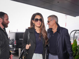 Amal Clooney's trip to the 2026 Winter Olympics appeared to fly by as quickly as Team USA figure skater Alysa Liu's short program. By February 8, the human rights lawyer had returned to Milan Airport. She wasn't dressed in Olympic gear either. Instead, a 2026 spin on the straight-leg jeans trend won the airport styling gold medal. Less than 48 hours after arriving in Italy, paparazzi caught Clooney in another travel-proof outfit. She ditched Friday's identical Versace outfit—down to the leopard-print boots—for comfortable basics, starting with a navy blue rollneck sweater and black peacoat. The surprises continued with her first pair of pants in eleven months: an emerging style of straight-leg jeans. She put on a pair of not-quite-flared, not-quite-skinny trousers with a clean-off-the-runway wash. Each leg gripped her thighs before gently fanning out like the straight-leg fashions of the past. They extended so far that Marie Claire couldn't recognise her black boots. Clooney's purse, on the other hand, was undoubtedly Chloé.
