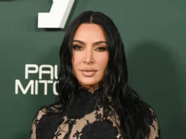 Kim Kardashian Shows Off Her Black Lace Bra in a Slinky LBD That Plunges All the Way Down to Her Stomach