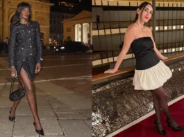 A women's custom-made black sequined vintage blazer jacket featuring a silver-tone buckle closure at the waist.