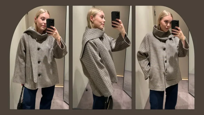 Elegant oversized winter coat with structured funnel neck collar and button front detail.