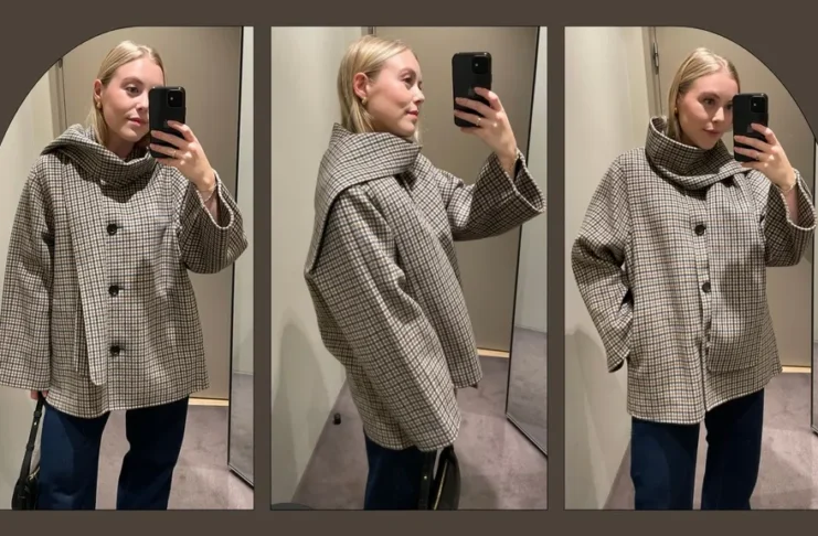 Elegant oversized winter coat with structured funnel neck collar and button front detail.