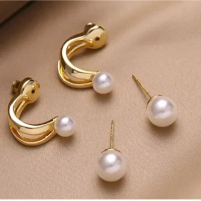 Detailed view of pearl alloy stud earrings with smooth finish and elegant design
