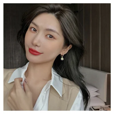 Women wearing minimalist opal earrings fashion look