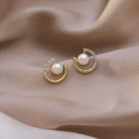 Hollow circle imitation pearl stud earrings for women