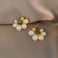 Elegant pearl earrings with metal inlay design for women