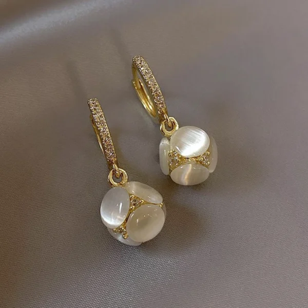 Fashion opal stud earrings close-up studio shot