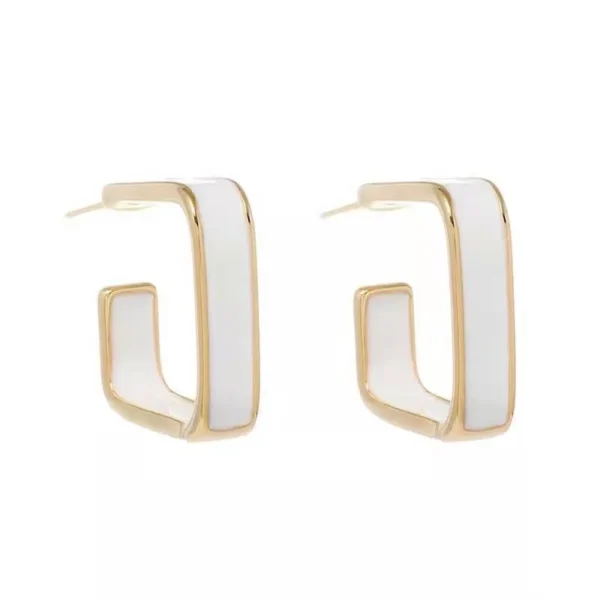 Close-up white enamel C shape earrings detail