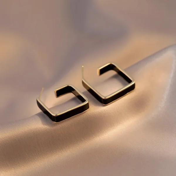 Elegant geometric earrings close-up studio shot