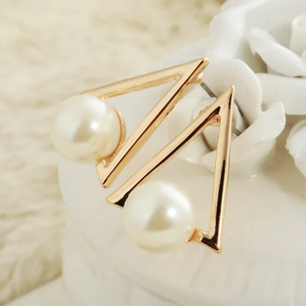 Elegant pearl triangle earrings close-up shot