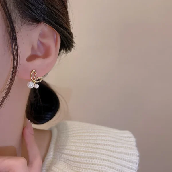 Side view metal bow earrings elegant design