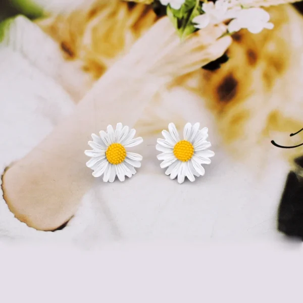 Sweet flower earrings close-up studio shot
