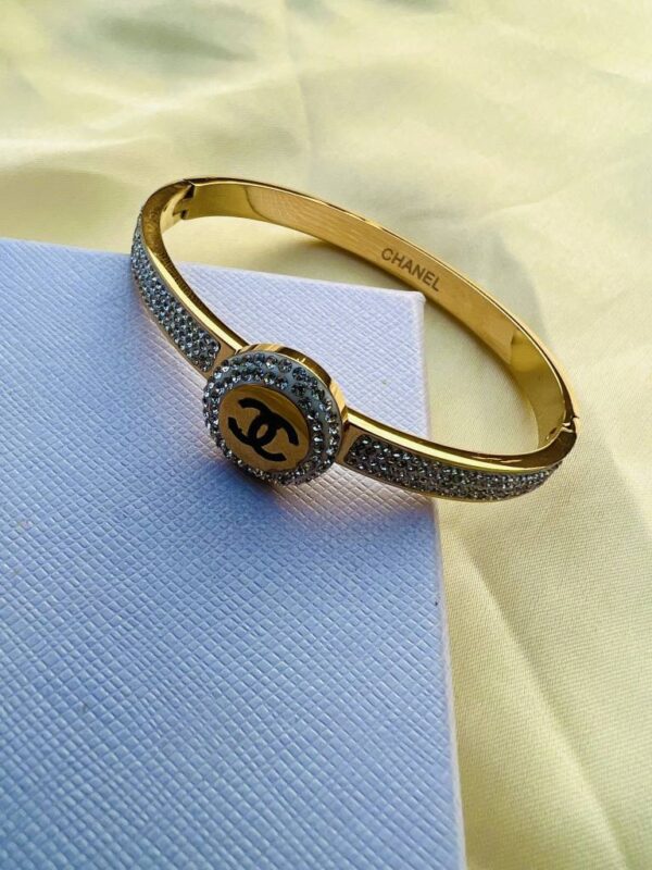 Women gold CC bangle lifestyle shot
