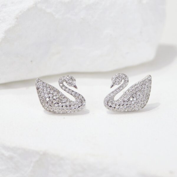 White swan stud earring close-up view